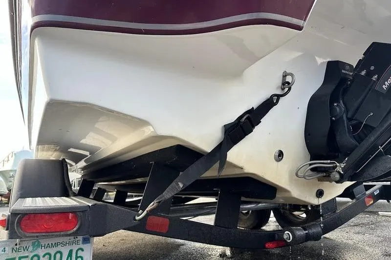 Slide: The Image of 2018 Tahoe 215 Xi boat on trailer with New Hampshire license plate. - 8