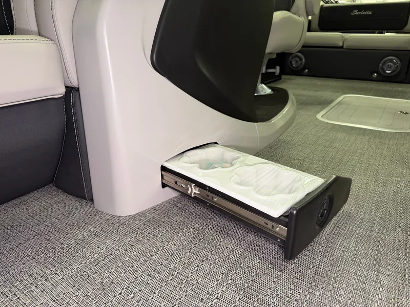 Slide: The Image of A pull-out drawer in a Barletta Cabrio 24 UE boat, mounted on a carpeted floor. - 14