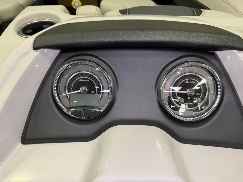 Slide: The Image of Close-up of two round gauges on the dashboard of a Barletta Cabrio 24 UE boat. - 18