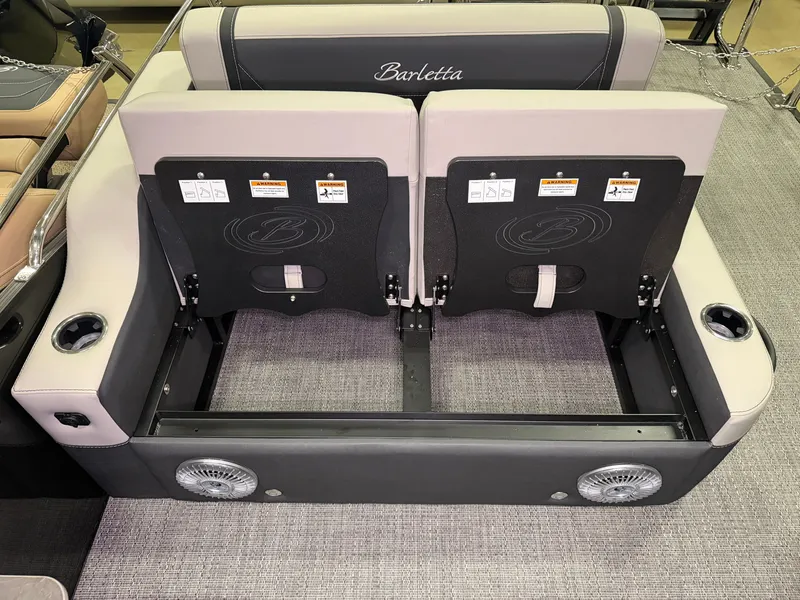 Slide: The Image of The back of a Barletta Cabrio 24 UE boat seat with cup holders and speakers. - 35