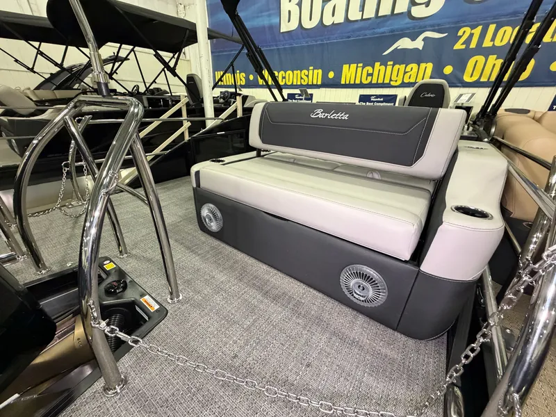 Slide: The Image of The image shows the interior of a 2026 Barletta Cabrio 24 UE with gray seating and stainless steel railings. - 37