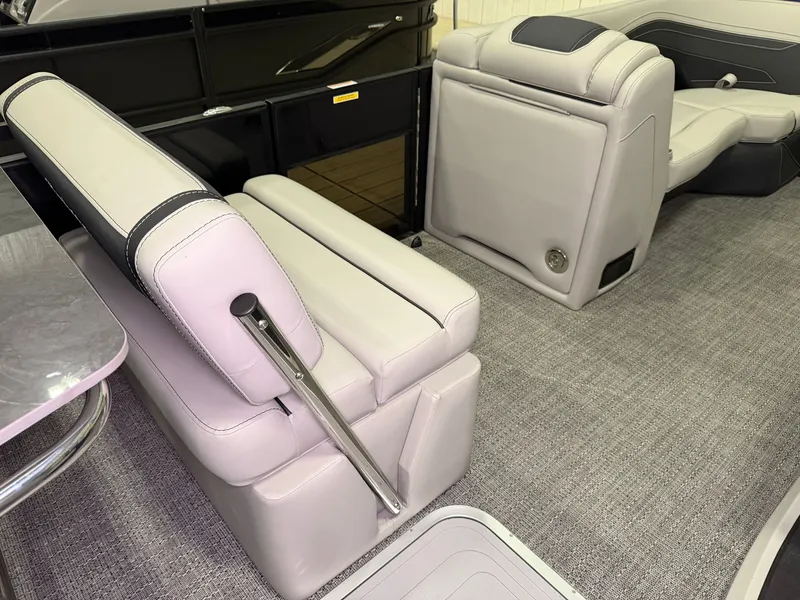 Slide: The Image of Interior of a Barletta Cabrio 24 UE with gray upholstered seats and carpeted floor. - 26