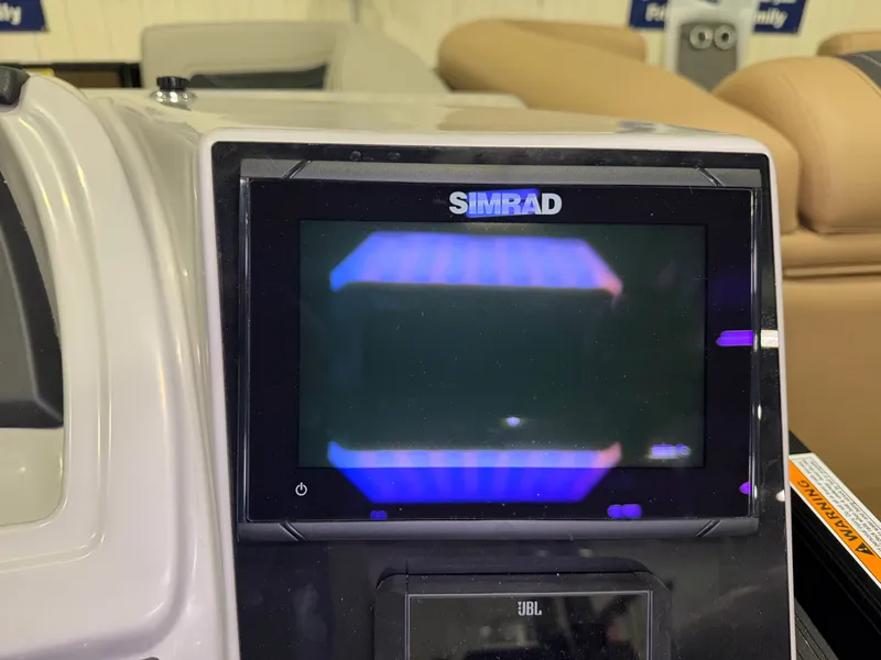 Slide: The Image of A Simrad screen on a Barletta Cabrio 24 UE boat, surrounded by beige seats. - 22
