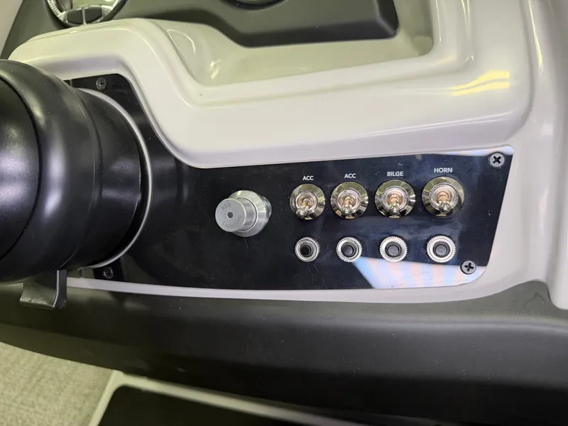 Slide: The Image of Close-up of the helm console with switches for accessories, bilge, and horn. - 20