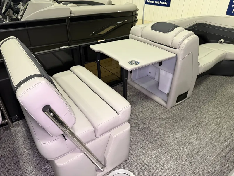 Slide: The Image of Interior of a 2026 Barletta Cabrio 24 UE with gray upholstered seats and a table. - 27