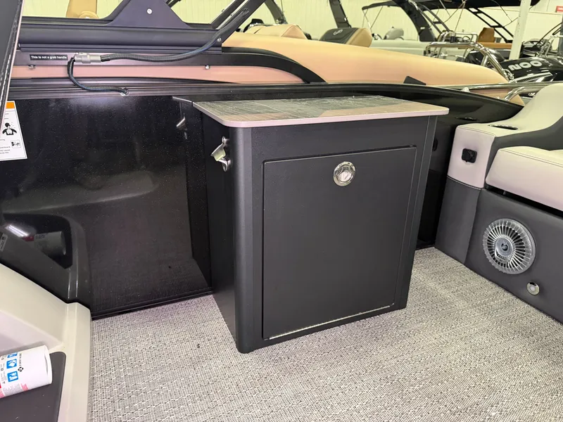 Slide: The Image of Interior of the Barletta Cabrio 24 UE featuring a black cabinet and beige upholstery. - 32