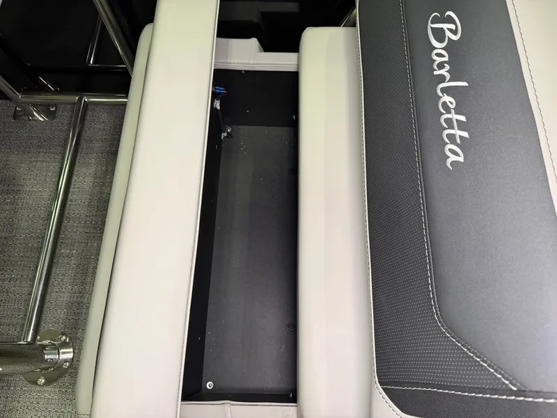 Slide: The Image of A seating area on a Barletta Cabrio 24 UE boat with storage underneath. - 28