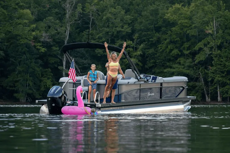 The Image of Family enjoying Barletta Cabrio 24 QC boat outing on the lake. - 0