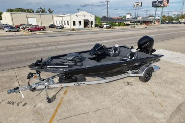 Slide: The Image of 2026 Vexus AVX181 boat on trailer, parked on urban street. - 1