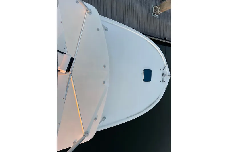 Slide: The Image of Top view of 2002 Out Island 38 Express Fisherman boat docked at a pier. - 10