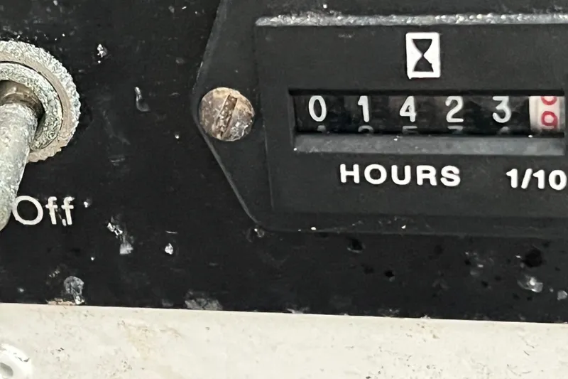 Slide: The Image of Hour meter reading 1423 hours on 2002 Out Island 38 Express Fisherman. - 16