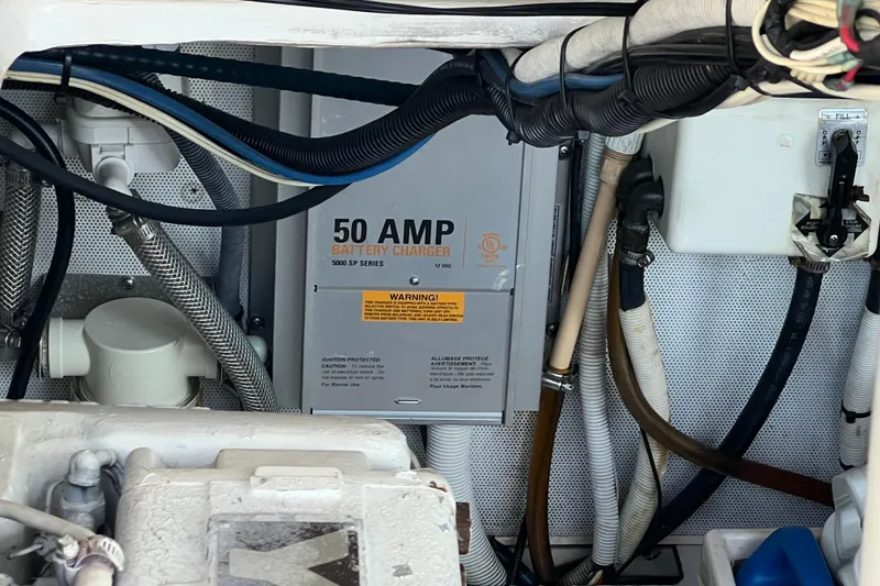 Slide: The Image of Engine compartment of 2002 Out Island 38 Express Fisherman with 50 AMP battery charger. - 20