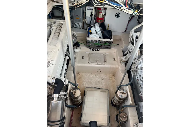 Slide: The Image of 2002 Out Island 38 Express Fisherman engine room with equipment and wiring. - 21