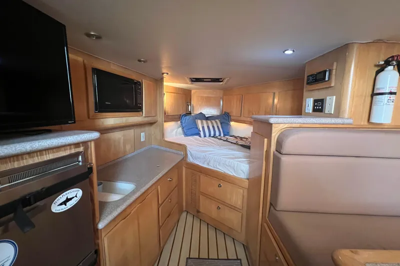 Slide: The Image of Interior of 2002 Out Island 38 Express Fisherman with cozy bed and modern amenities. - 23