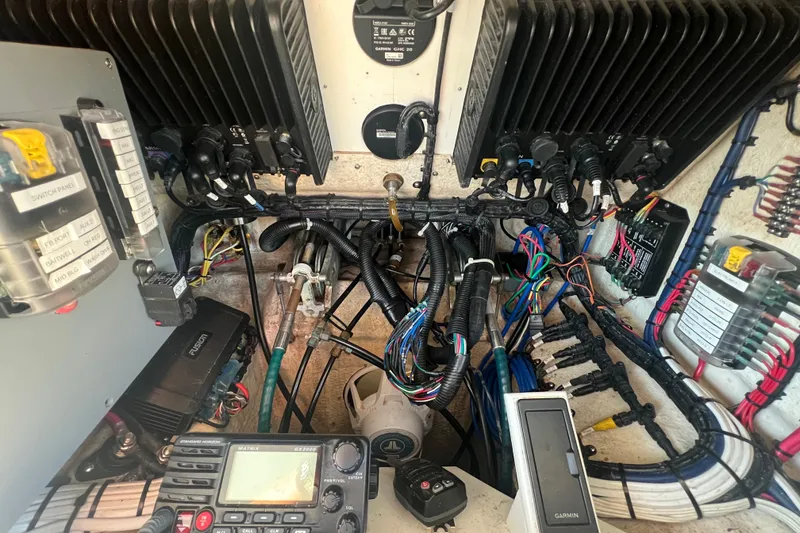 Slide: The Image of Electrical system of a 2002 Out Island 38 Express Fisherman boat with wiring and control panels. - 33