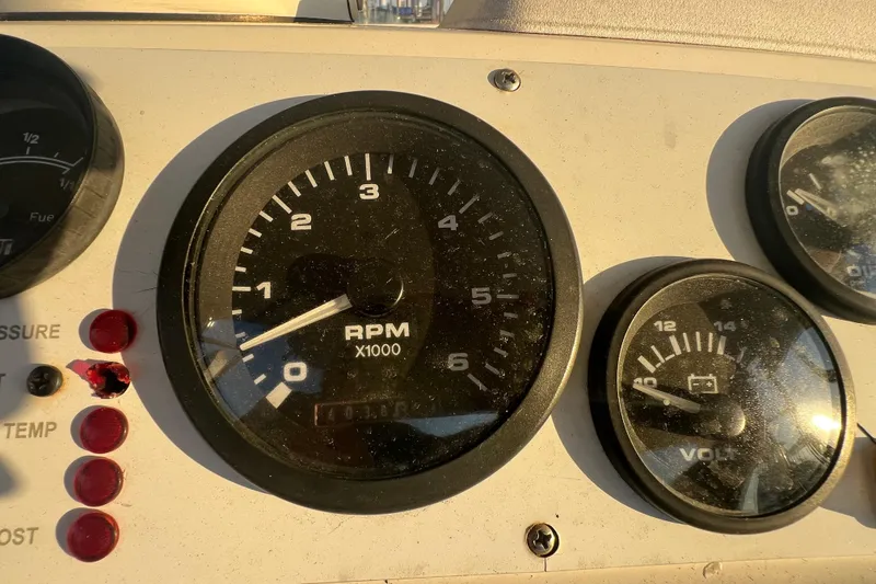 Slide: The Image of Close-up of 2002 Out Island 38 Express Fisherman dashboard gauges, showing RPM and voltage. - 35