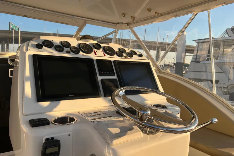 Slide: The Image of Helm of 2002 Out Island 38 Express Fisherman with dual screens and gauges. - 44