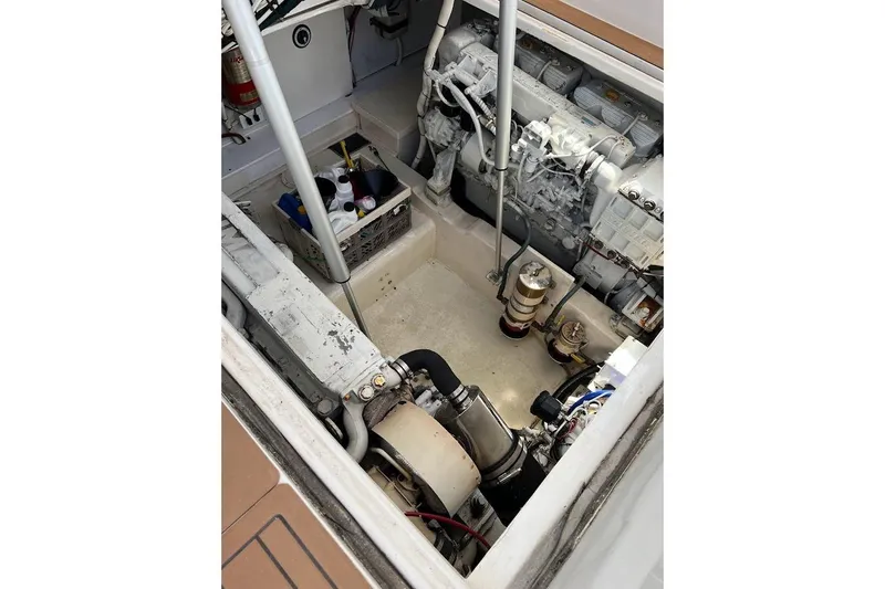 Slide: The Image of Engine compartment of a 2002 Out Island 38 Express Fisherman boat, showing machinery and equipment. - 7