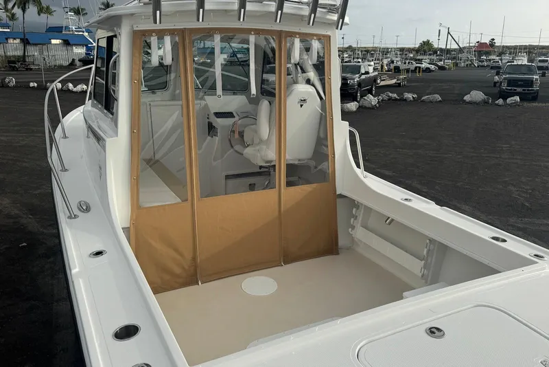 Slide: The Image of 2026 Steiger Craft 21 MIAMI boat with enclosed cabin, docked in a marina. - 10