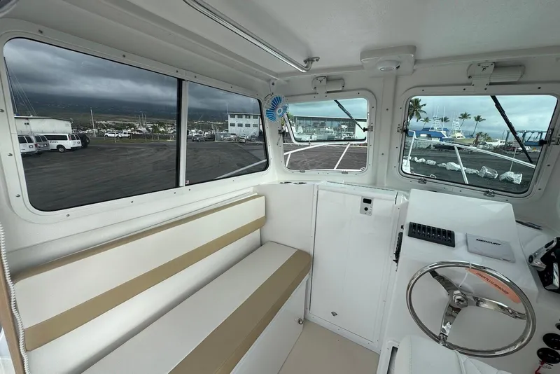 Slide: The Image of Interior of 2026 Steiger Craft 21 MIAMI boat with seating and steering wheel. - 14
