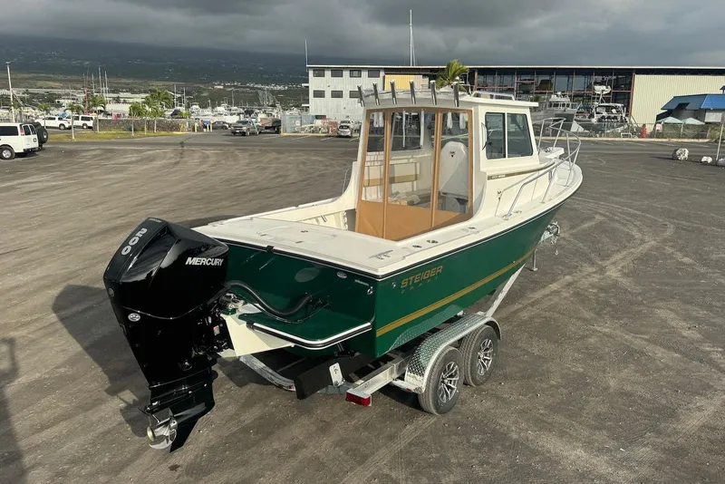 Slide: The Image of 2026 Steiger Craft 21 MIAMI boat on trailer with Mercury engine, parked outdoors. - 4
