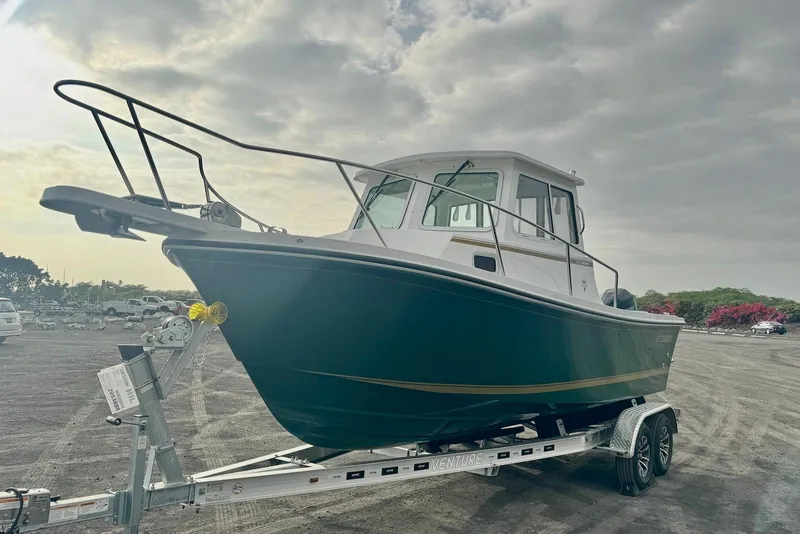 Slide: The Image of 2026 Steiger Craft 21 MIAMI boat on trailer under cloudy sky. - 7