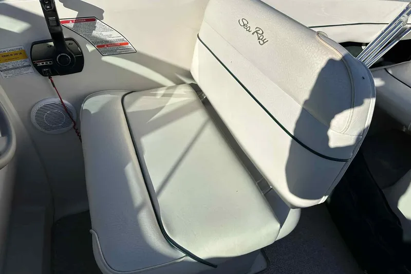 Slide: The Image of White seating area on a 2000 Sea Ray 215 Express Cruiser boat. - 15
