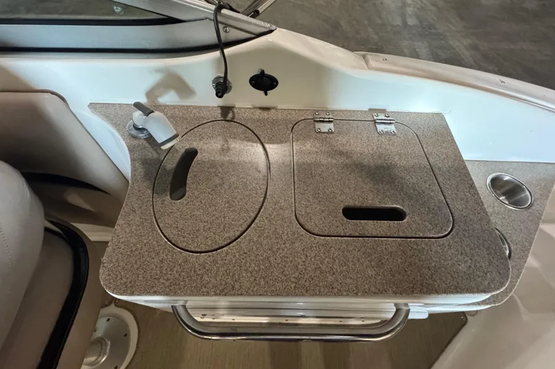 Slide: The Image of 2014 Hurricane SunDeck 2400 OB boat sink and countertop with faucet and storage compartments. - 20