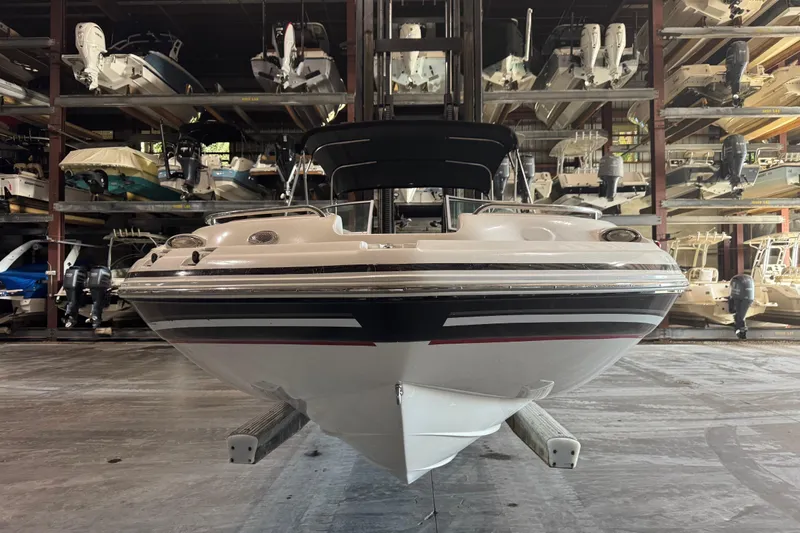 Slide: The Image of 2014 Hurricane SunDeck 2400 OB boat in indoor storage facility. - 5