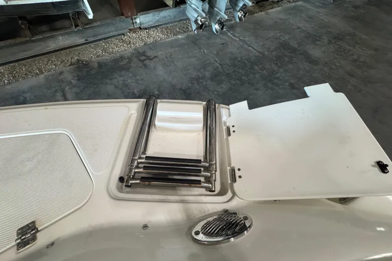 Slide: The Image of 2014 Hurricane SunDeck 2400 OB boat ladder and hatch detail. - 8