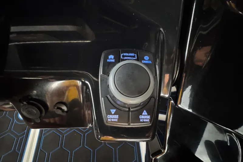 Slide: The Image of 2023 Yamaha AR250 boat control panel with cruise and volume buttons. - 12