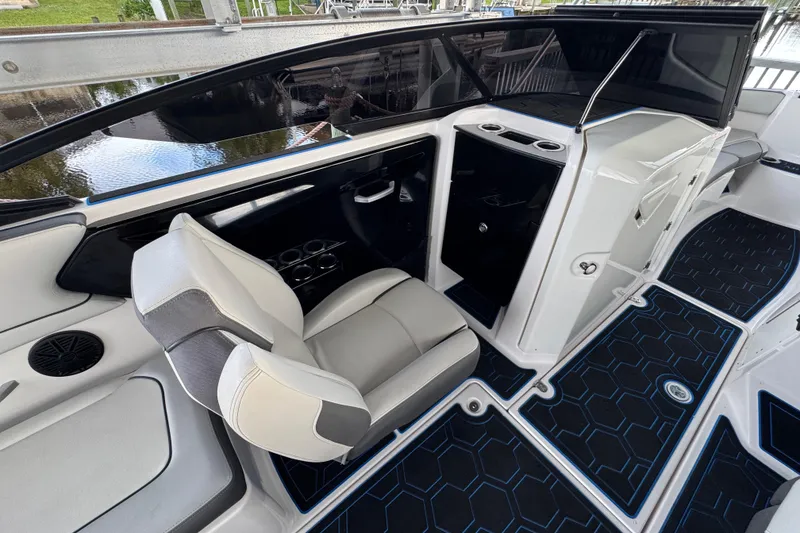 Slide: The Image of 2023 Yamaha Boats AR250 interior with modern seating and sleek design. - 13