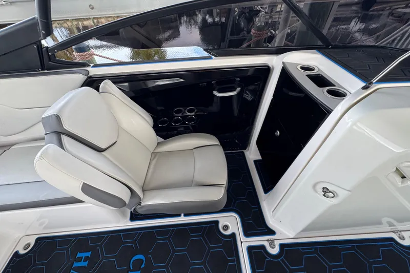 Slide: The Image of 2023 Yamaha Boats AR250 interior with sleek seating and modern design elements. - 14