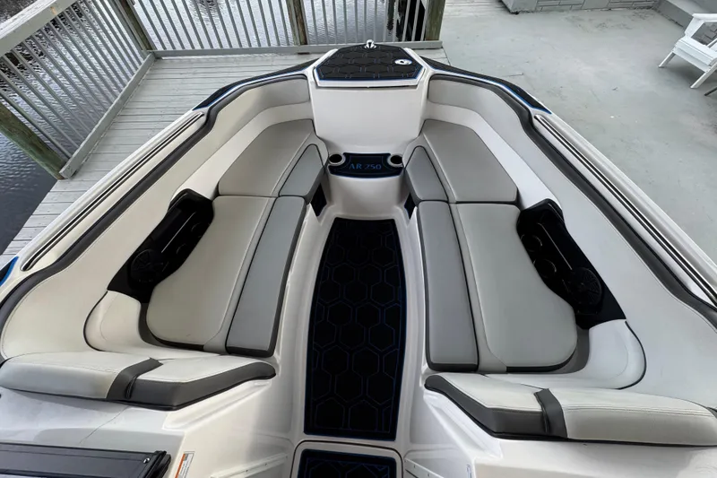 Slide: The Image of 2023 Yamaha Boats AR250 interior with sleek seating and modern design. - 15