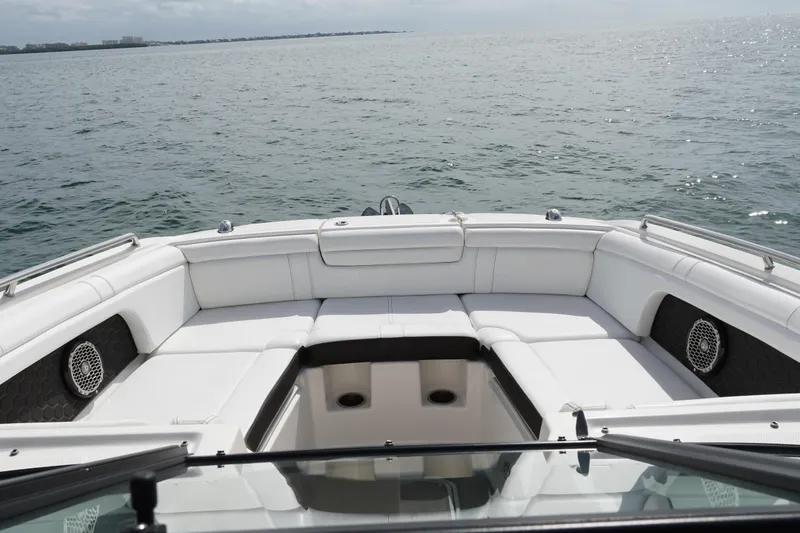 Slide: The Image of 2018 Sea Ray SDX 290 boat with spacious seating on open water. - 9