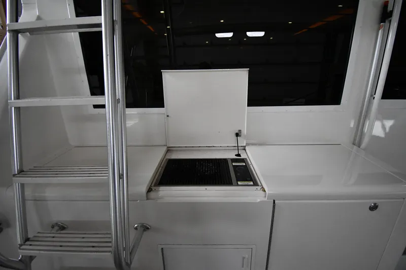 Slide: The Image of Outdoor grill and ladder on 1996 Viking 50 Convertible yacht deck. - 12