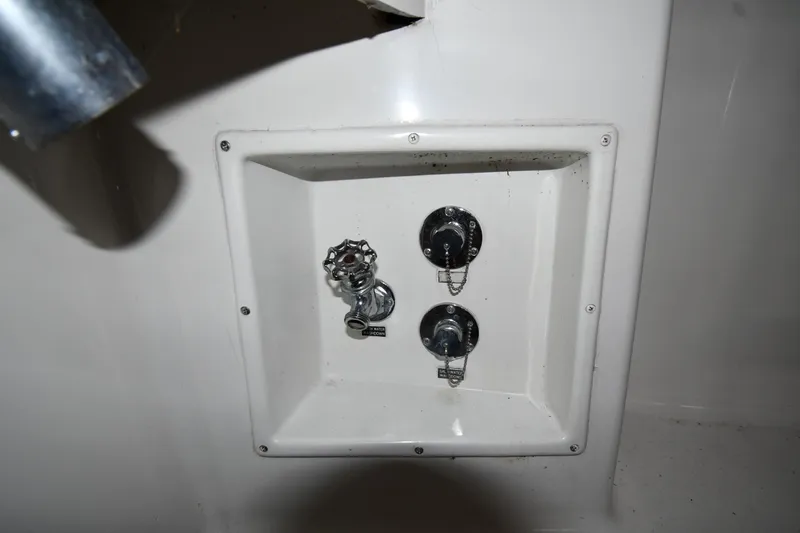 Slide: The Image of Control panel on a 1996 Viking 50 Convertible boat, featuring knobs and switches. - 14