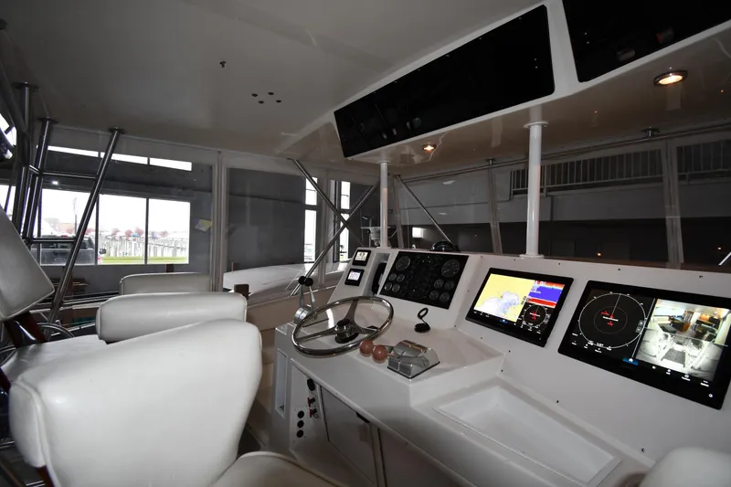 Slide: The Image of Interior helm of 1996 Viking 50 Convertible yacht with modern navigation equipment. - 16
