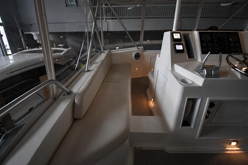 Slide: The Image of Interior of 1996 Viking 50 Convertible yacht with helm and seating area. - 17