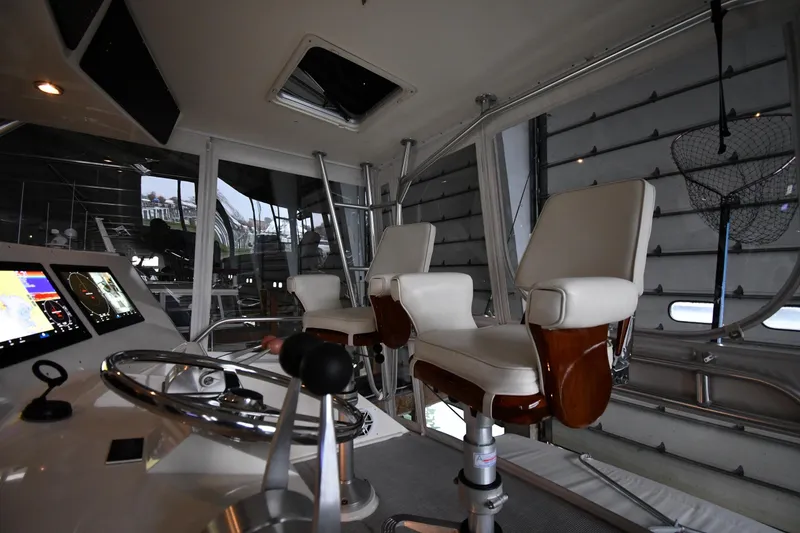 Slide: The Image of Interior of 1996 Viking 50 Convertible yacht with helm and seating. - 21