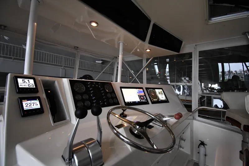Slide: The Image of Control panel of a 1996 Viking 50 Convertible yacht with modern navigation instruments. - 22