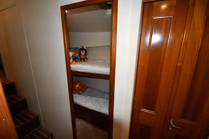 Slide: The Image of Bunk beds with toys in 1996 Viking 50 Convertible yacht cabin. - 36