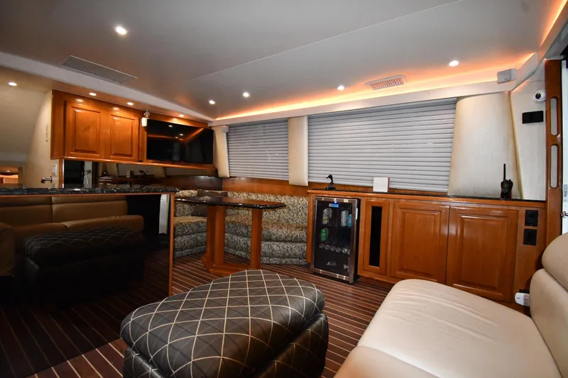 Slide: The Image of Luxurious interior of a 1996 Viking 50 Convertible yacht with elegant wood finishes. - 50
