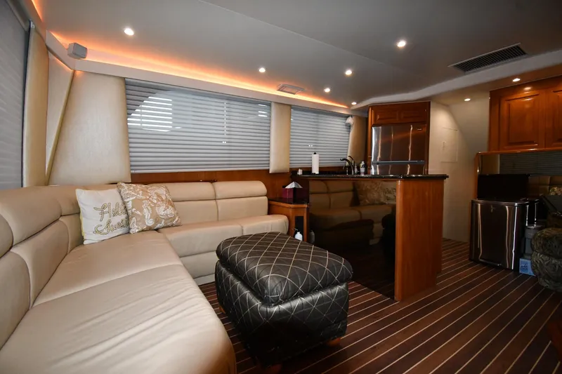 Slide: The Image of Luxurious interior of a 1996 Viking 50 Convertible yacht with elegant seating and modern amenities. - 51