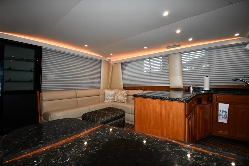 Slide: The Image of Luxurious interior of 1996 Viking 50 Convertible yacht with modern lighting and elegant furnishings. - 52