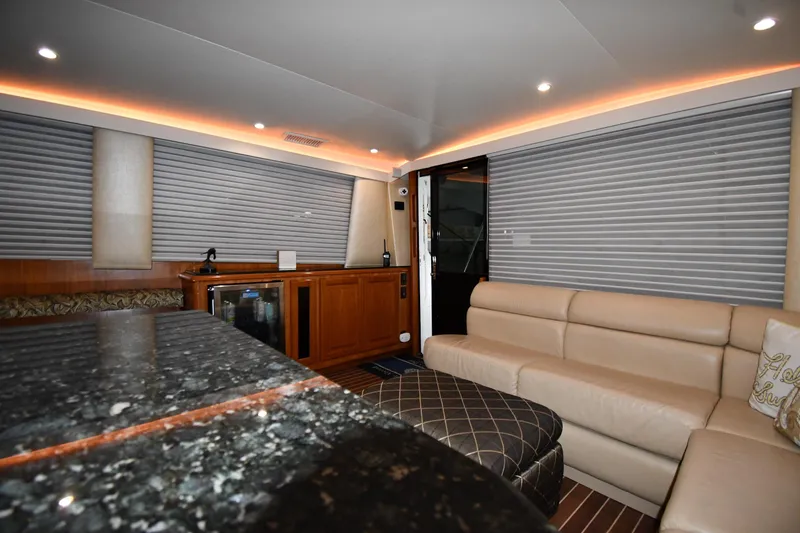 Slide: The Image of Luxurious interior of 1996 Viking 50 Convertible yacht with leather seating and modern amenities. - 53