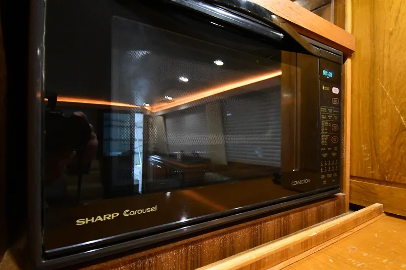 Slide: The Image of Sharp Carousel microwave in 1996 Viking 50 Convertible yacht kitchen. - 57