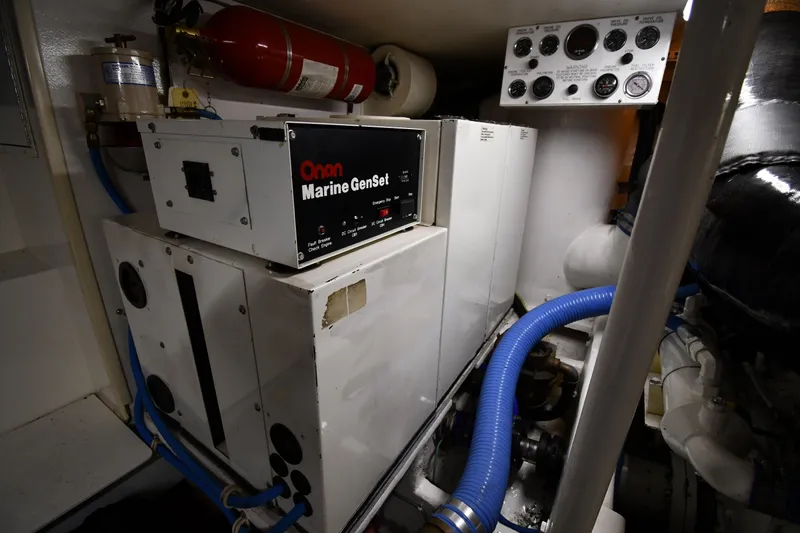 Slide: The Image of Engine room of 1996 Viking 50 Convertible with Onan Marine GenSet and control panel. - 66