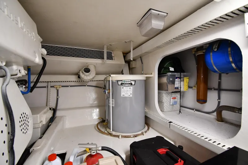 Slide: The Image of Engine room of 1996 Viking 50 Convertible yacht with equipment and storage. - 68
