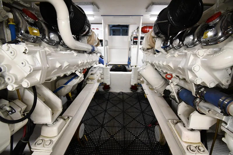 Slide: The Image of Engine room of 1996 Viking 50 Convertible yacht, showcasing dual engines and mechanical components. - 69